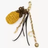 Bijou de sac ananas en raphia, métal et cuir