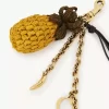 Bijou de sac ananas en raphia, métal et cuir