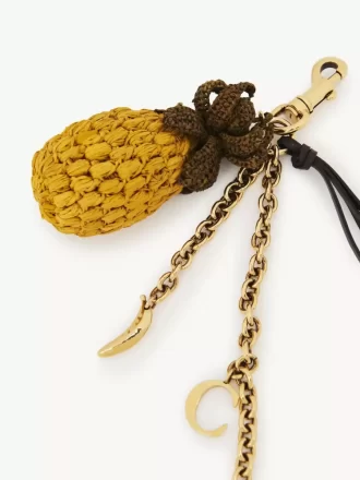 Bijou de sac ananas en raphia, métal et cuir