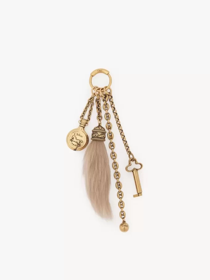 Bijou de sac Chloé Symbols en laiton et peau lainée