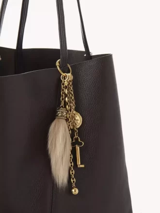 Bijou de sac Chloé Symbols en laiton et peau lainée
