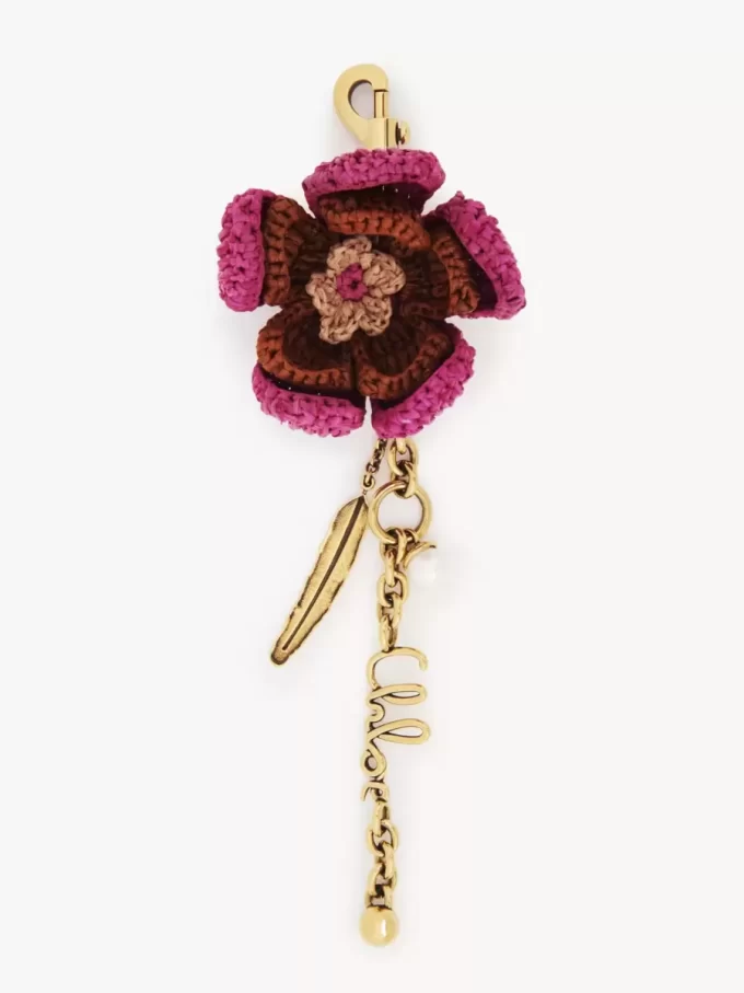 Bijou de sac fleur en raphia et métal Bijou de sac fleur en raphia et métal