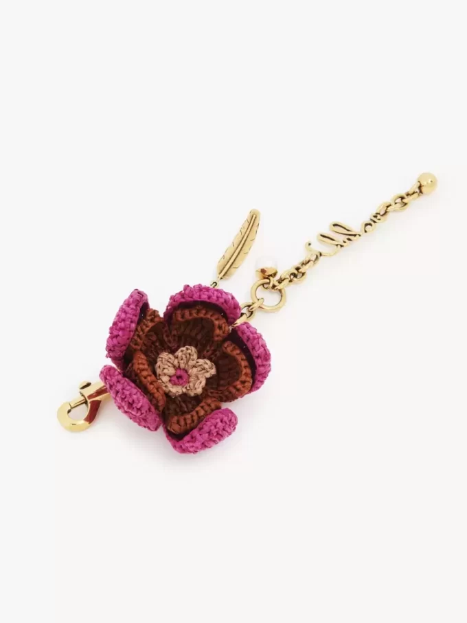 Bijou de sac fleur en raphia et métal Bijou de sac fleur en raphia et métal