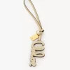 Bijou de sac logo en cuir brillant Bijou de sac logo en cuir brillant