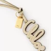 Bijou de sac logo en cuir brillant Bijou de sac logo en cuir brillant