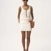 Mini-jupe festonnée en mélange de coton Mini-jupe festonnée en mélange de coton