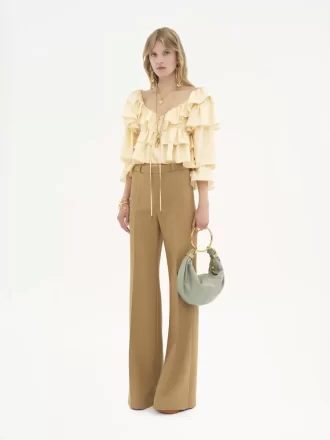 Pantalon tailleur évasé en laine grain de poudre