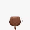 Petit sac de selle Marcie en cuir brillant Petit sac de selle Marcie en cuir brillant
