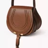 Petit sac de selle Marcie en cuir brillant Petit sac de selle Marcie en cuir brillant
