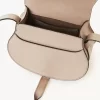 Petit sac de selle Marcie en cuir brillant Petit sac de selle Marcie en cuir brillant