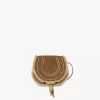 Petit sac de selle Marcie en cuir suédé et peau lainée Petit sac de selle Marcie en cuir suédé et peau lainée