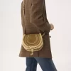 Petit sac de selle Marcie en cuir suédé et peau lainée Petit sac de selle Marcie en cuir suédé et peau lainée