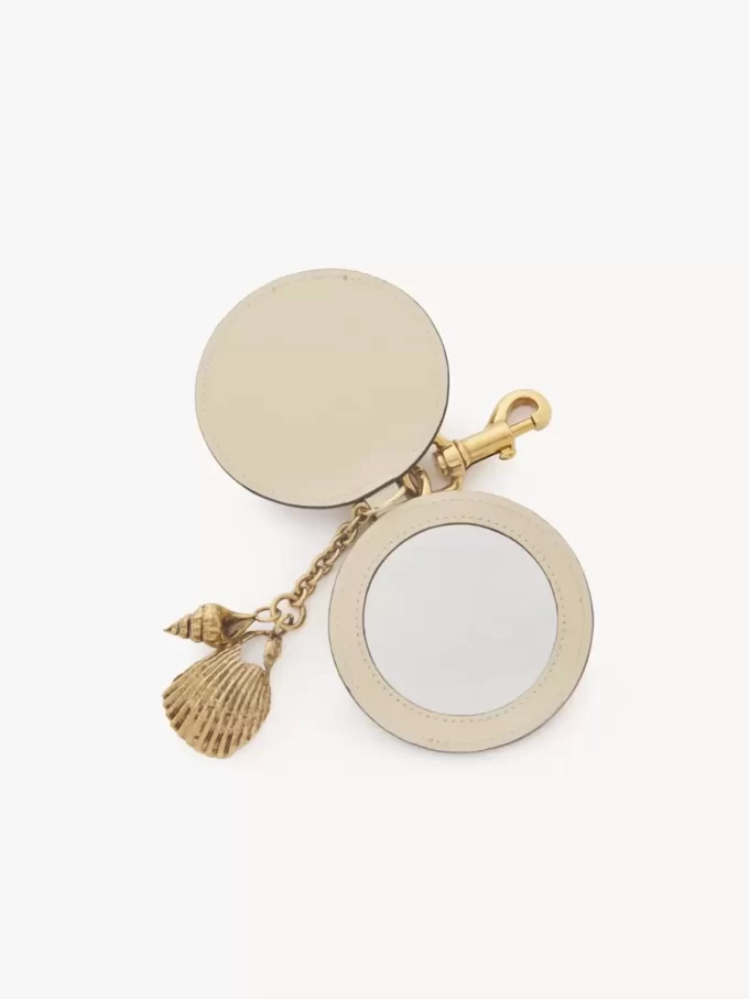 Porte-clés miroir avec coque en cuir brillant Porte-clés miroir avec coque en cuir brillant