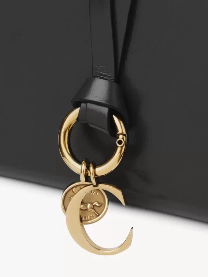 Portefeuille à deux volets Alphabet en cuir brillant Portefeuille à deux volets Alphabet en cuir brillant