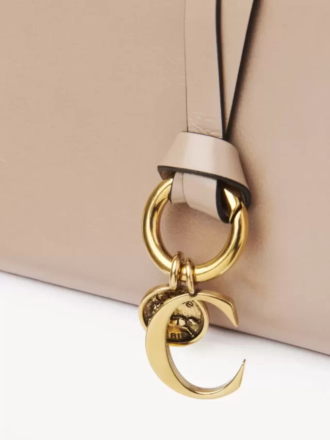 Portefeuille à deux volets Alphabet en cuir brillant Portefeuille à deux volets Alphabet en cuir brillant